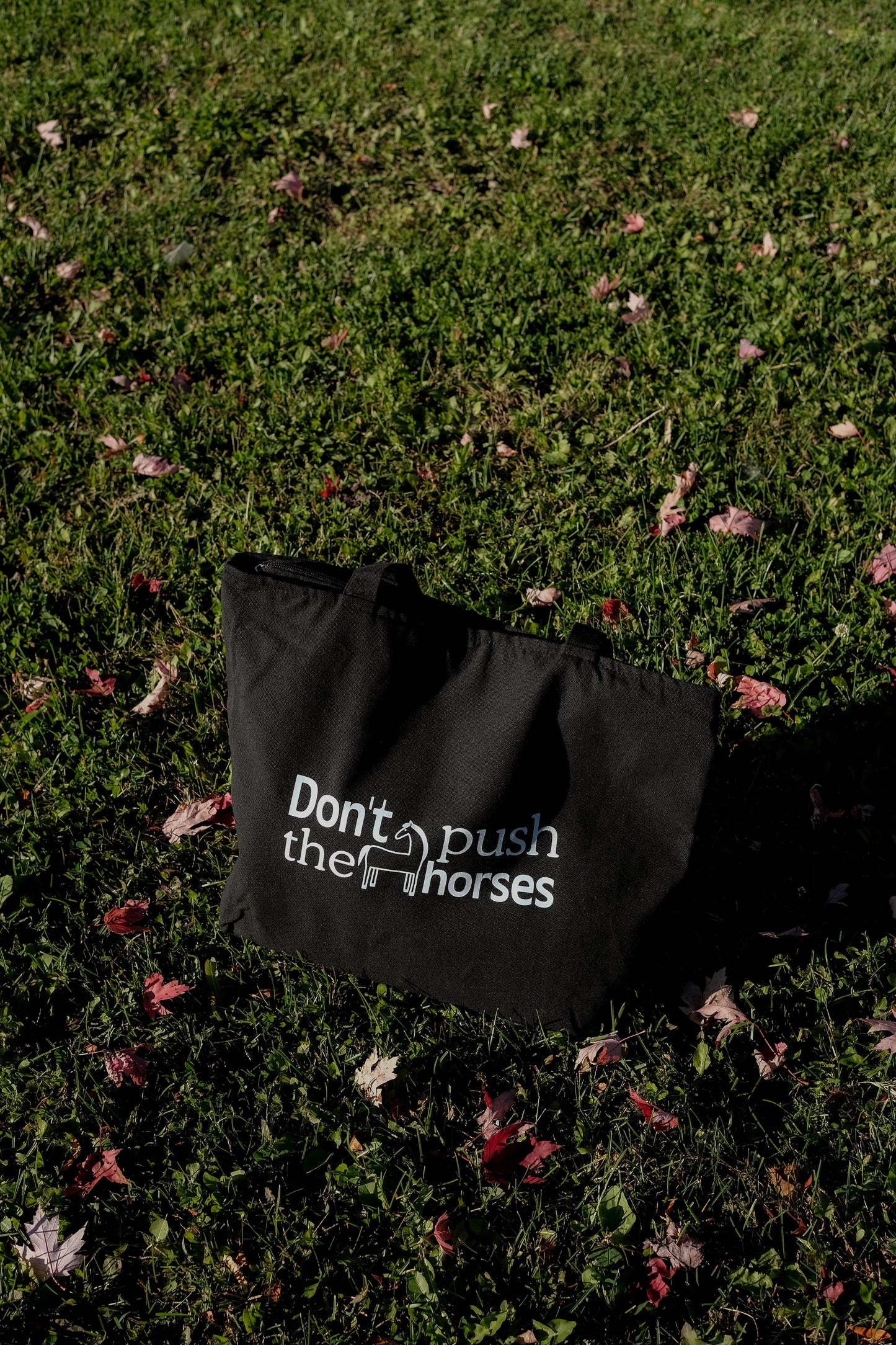 'Don't push the horses' Black Tote Bag